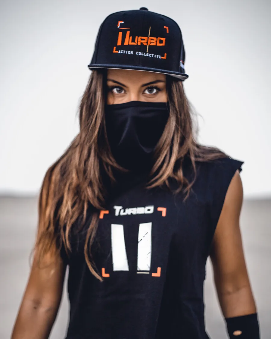 Turbo Action Wear — model in Turbo cap and cropped tee